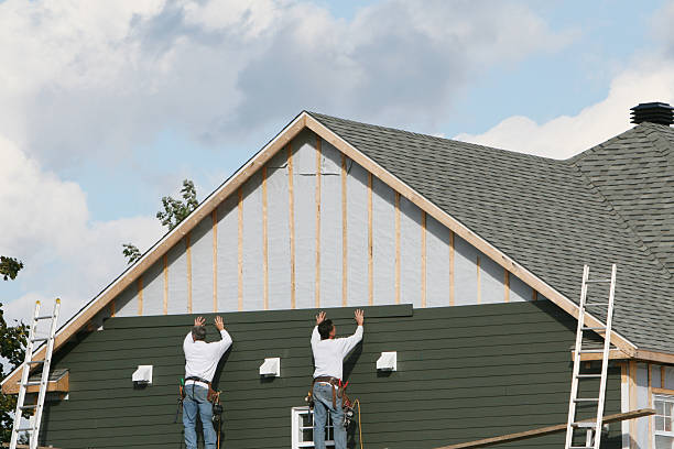 Professional Emergency Siding Repair technician working in Fort Loramie, OH
